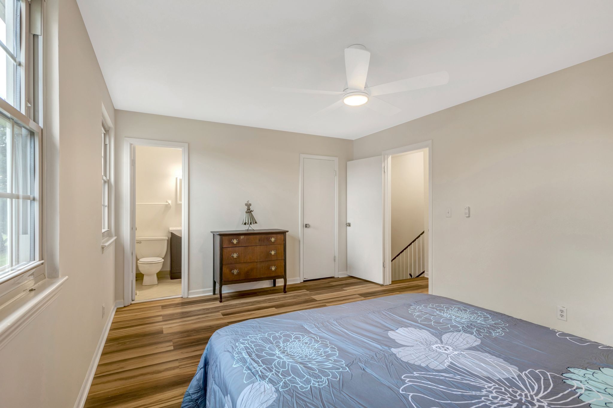 1011 Murfreesboro Road, Unit B2 Franklin, TN 37064 - Photo 18 of 39 a bedroom with a bed and a chandelier