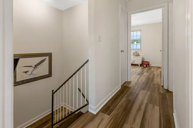 a view of a livingroom with furniture and staircase