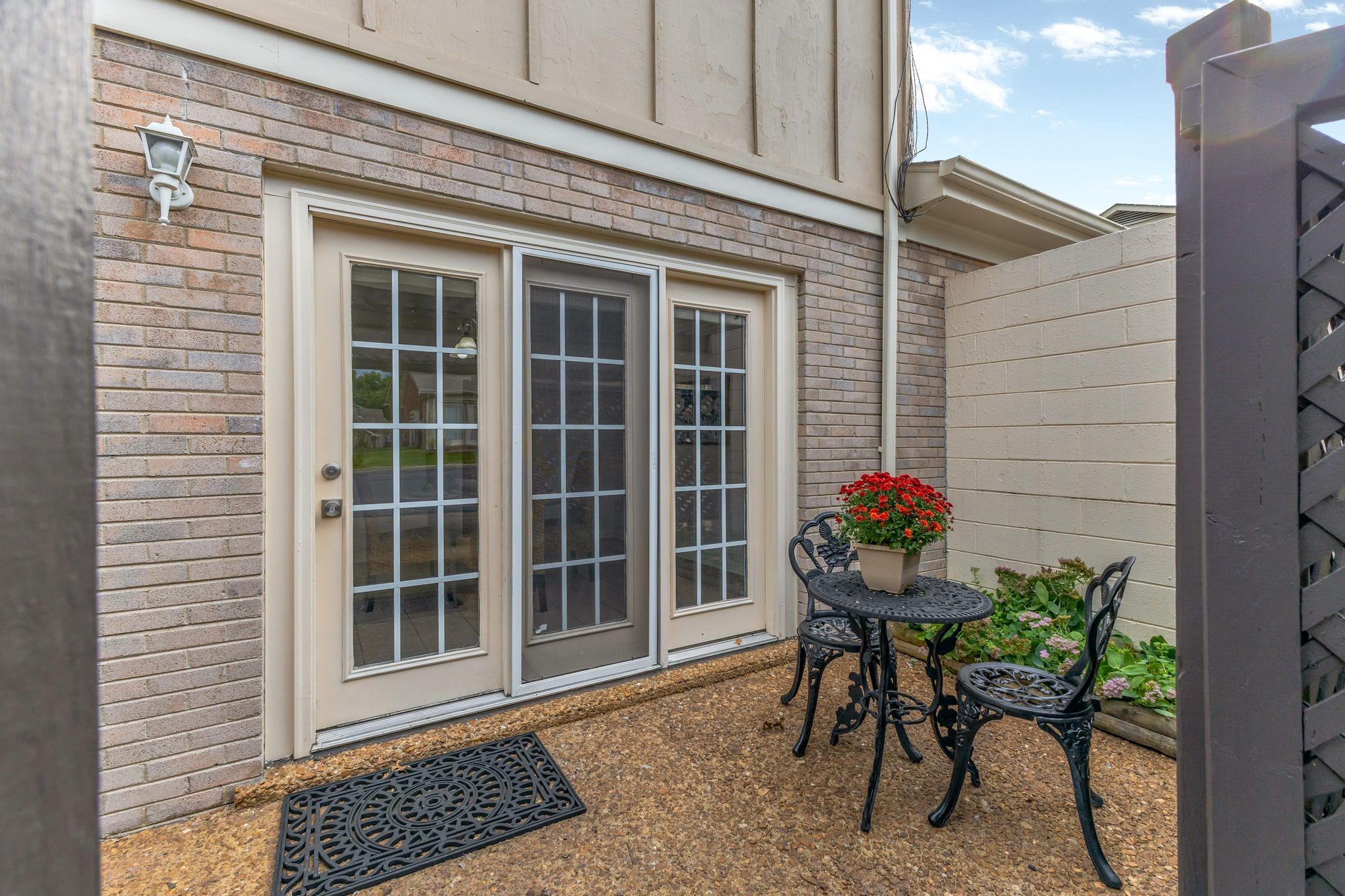 1011 Murfreesboro Road, Unit B2 Franklin, TN 37064 - Photo 29 of 39 a view of a porch with a table and chair and potted plants