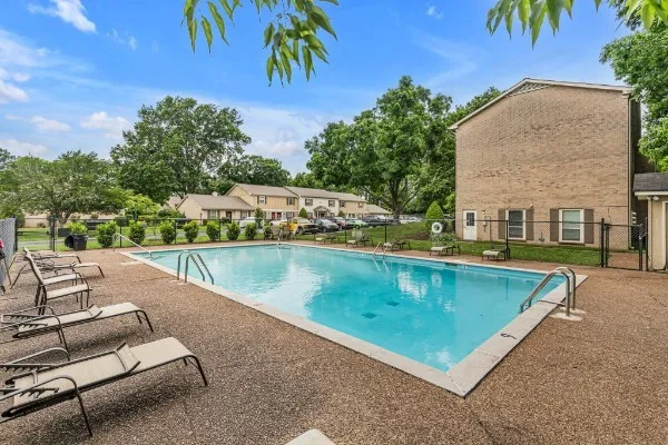 a view of a swimming pool with a patio