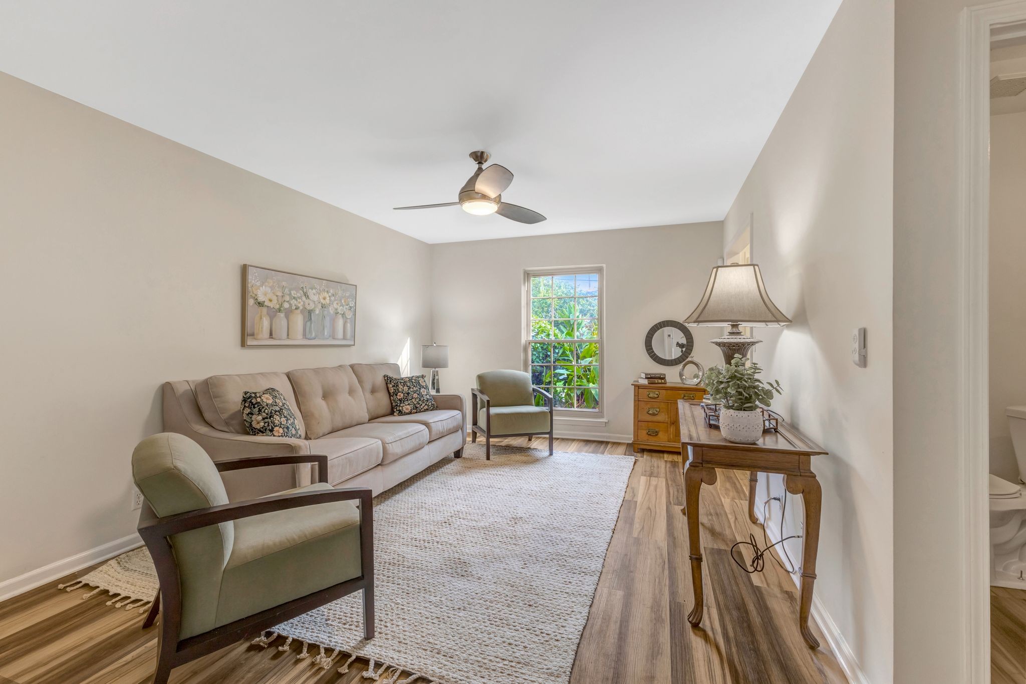 1011 Murfreesboro Road, Unit B2 Franklin, TN 37064 - Photo 6 of 39 a living room with furniture and a clock