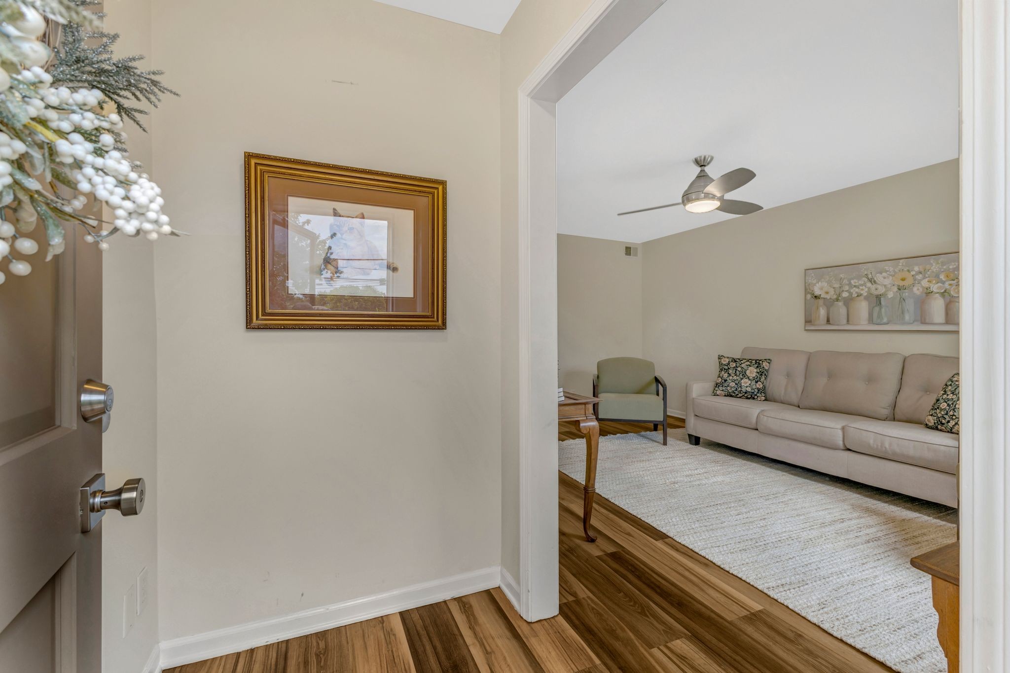 1011 Murfreesboro Road, Unit B2 Franklin, TN 37064 - Photo 8 of 39 a living room with furniture and a chandelier