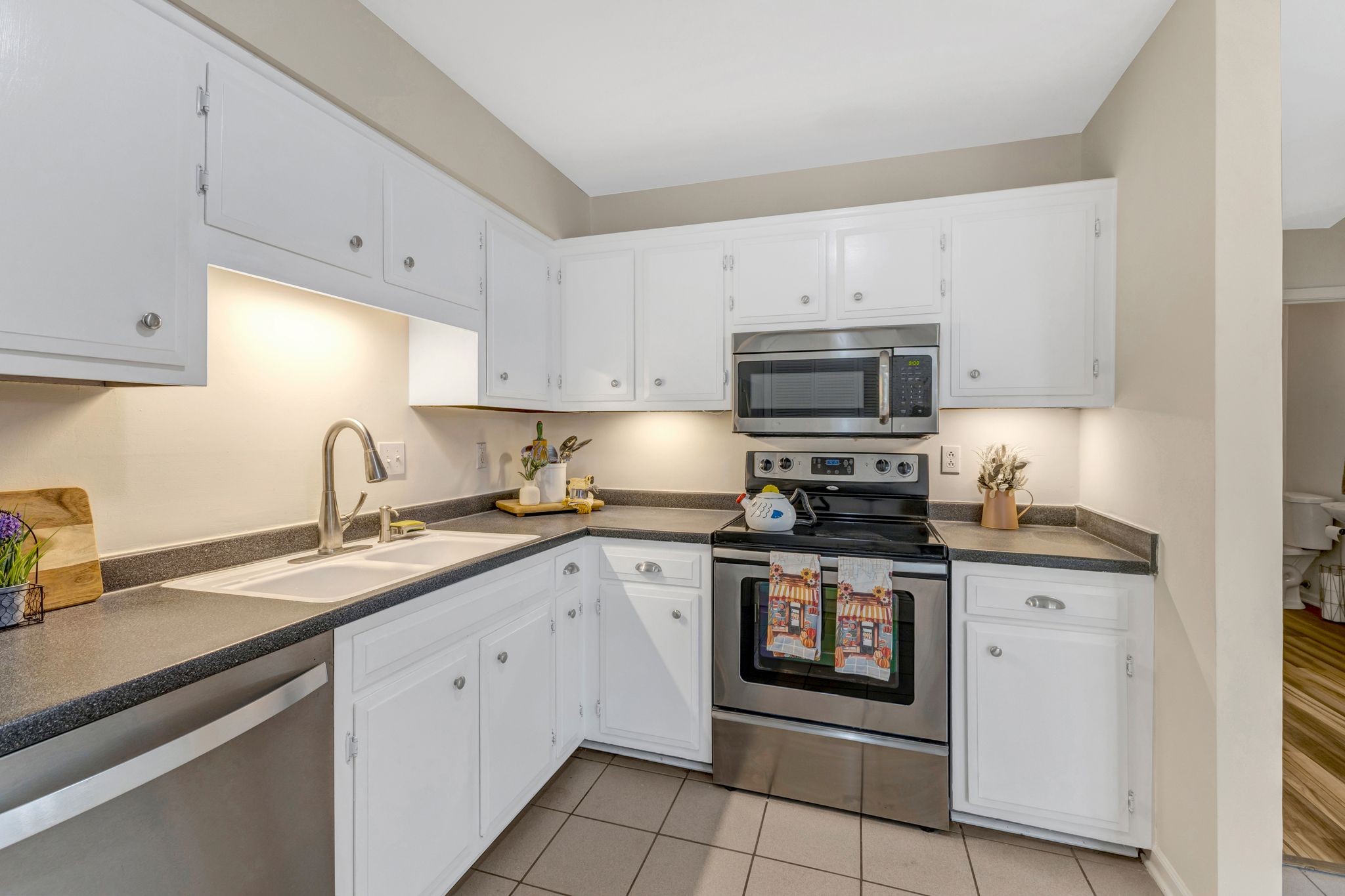 1011 Murfreesboro Road, Unit B2 Franklin, TN 37064 - Photo 9 of 39 a kitchen with stainless steel appliances granite countertop a sink and a stove