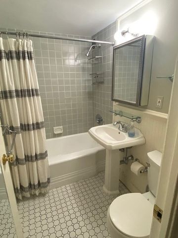 front view of a building and a potted plant