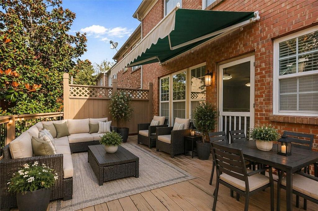 2872 Overlook Way Northeast Atlanta, GA 30324 - Photo 2 of 47 a view of a patio with couches table and chairs and potted plants