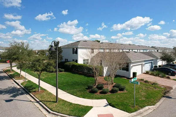 a kitchen that has a sink stainless steel appliances a counter space and cabinets