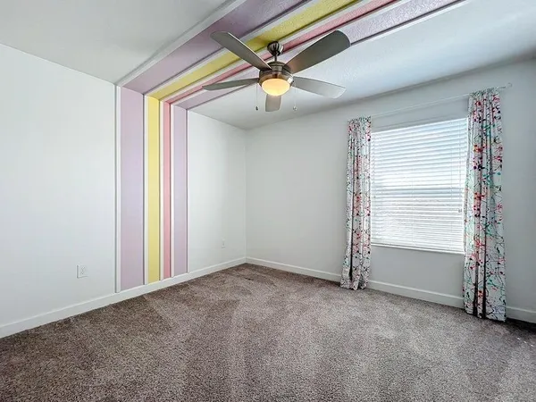 a view of entryway with wooden floor and front door