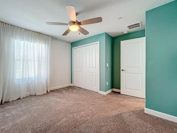 a view of a kitchen with wooden floor and a sink