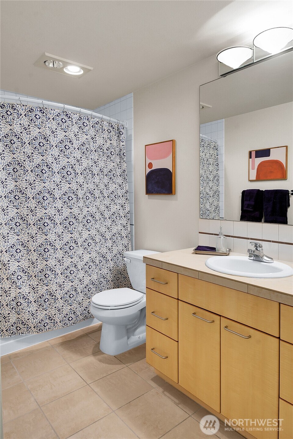 5001 California Avenue Southwest, Unit 212 Seattle, WA 98136 - Photo 17 of 18 a bathroom with a toilet sink and mirror