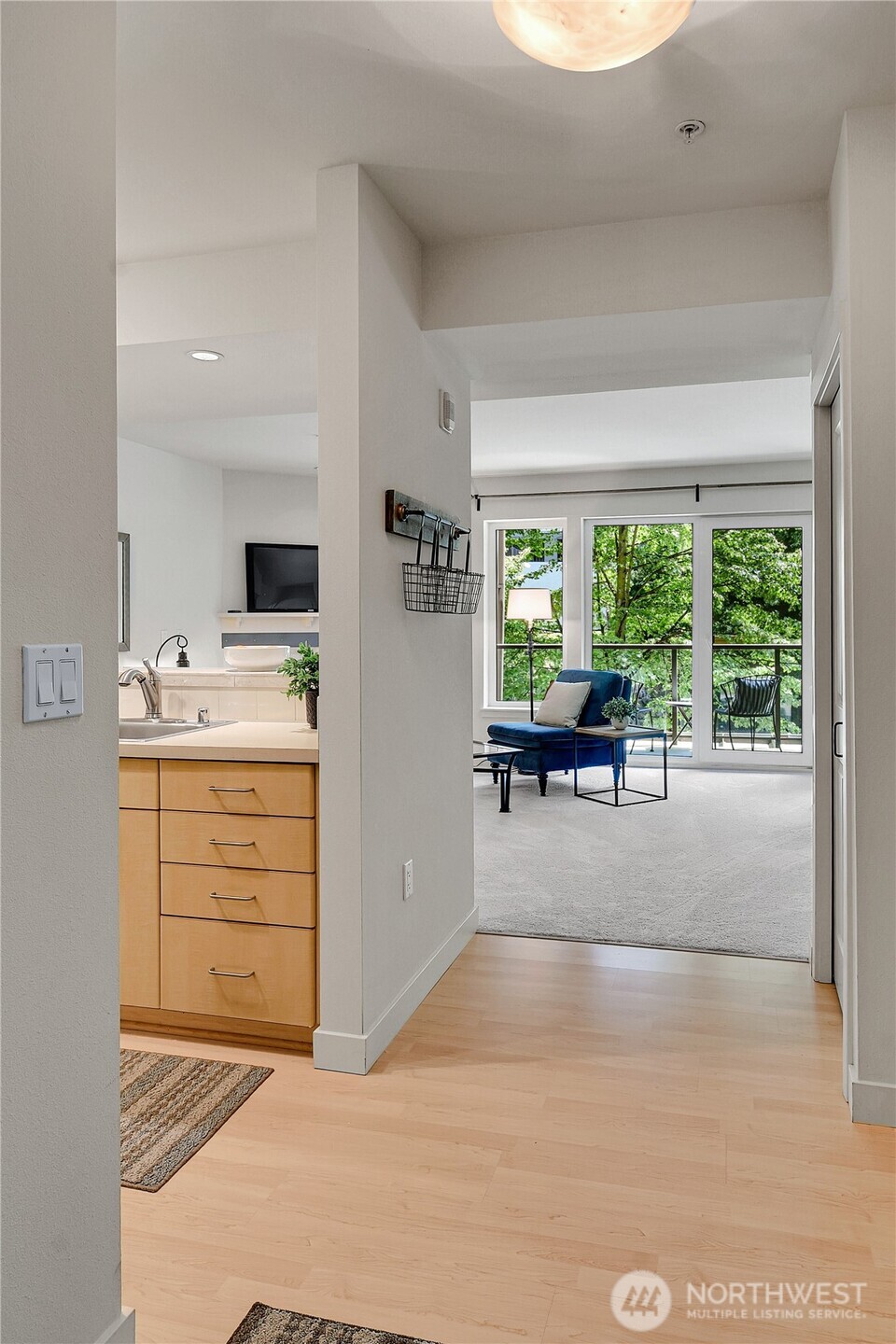 5001 California Avenue Southwest, Unit 212 Seattle, WA 98136 - Photo 9 of 18 a room with furniture and a flat screen tv