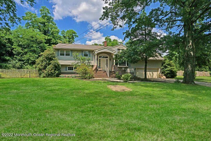 5 Arlene Drive West Long Branch, NJ 07764 - Photo 2 of 17 a front view of a house with garden