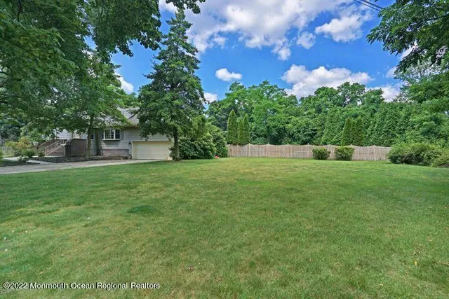 a backyard of a house with lots of green space