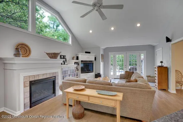 a living room with furniture a window and a fireplace