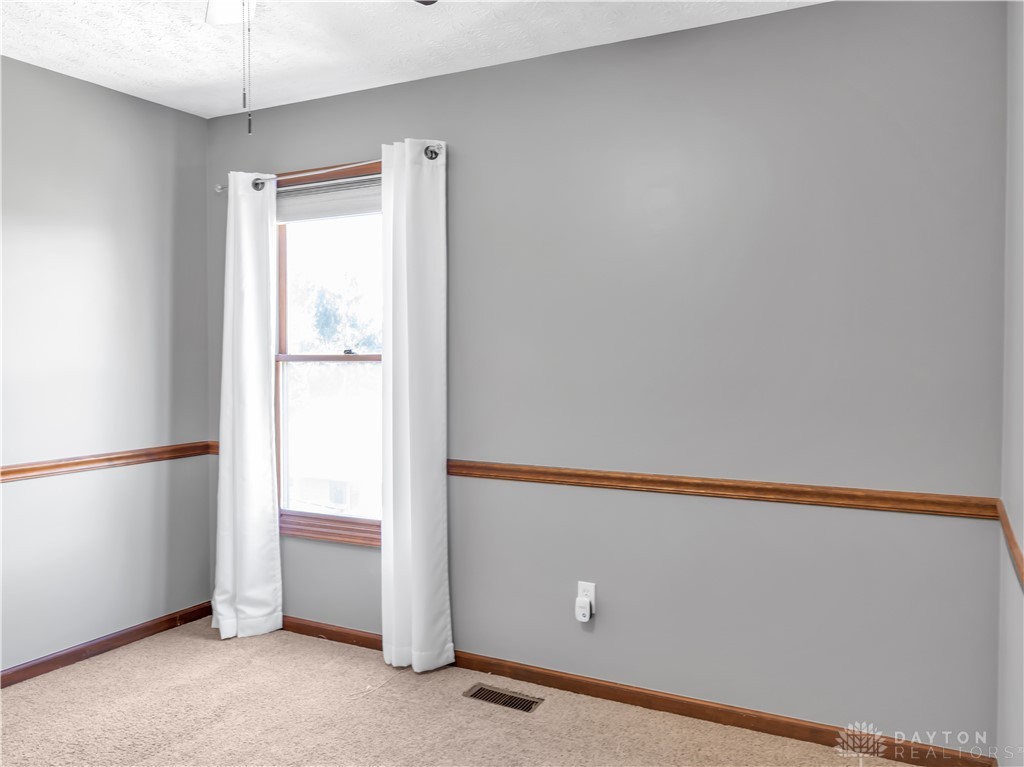 25 Callaway Springboro, OH 45066 - Photo 34 of 51 This cozy room offers carpet flooring and a window, creating a comfortable and inviting atmosphere.