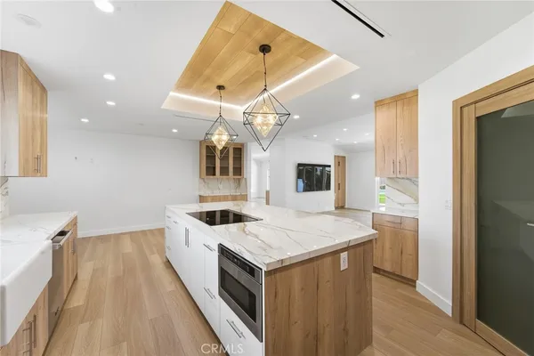a kitchen with a sink and a refrigerator
