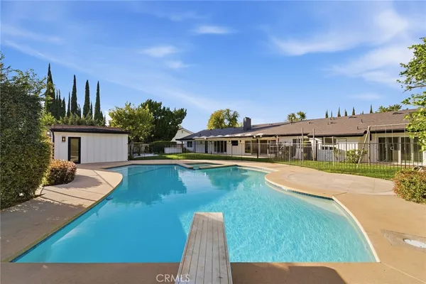a view of a house with swimming pool