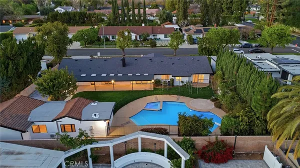 an aerial view of houses with yard