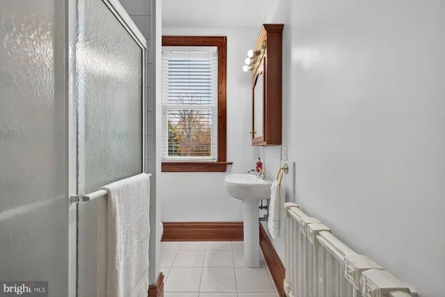 a bathroom with a bathtub and a sink