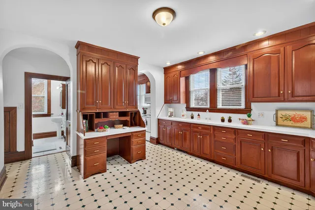 a kitchen with stainless steel appliances a sink a stove and cabinets