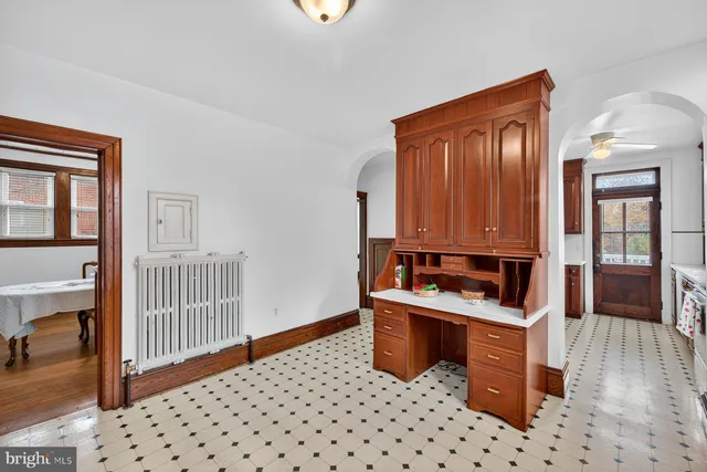 a room with furniture a mirror and shower