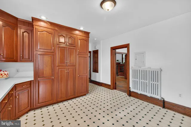 a area with wooden floor and cabinet