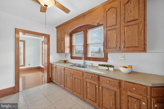 a white refrigerator freezer and a stove sitting inside of a kitchen