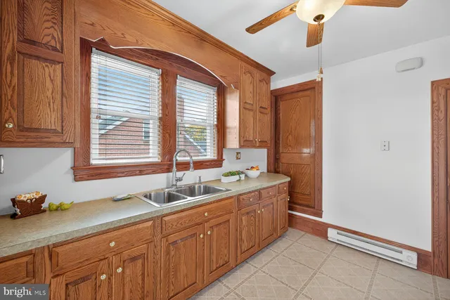 a white refrigerator freezer sitting in a kitchen