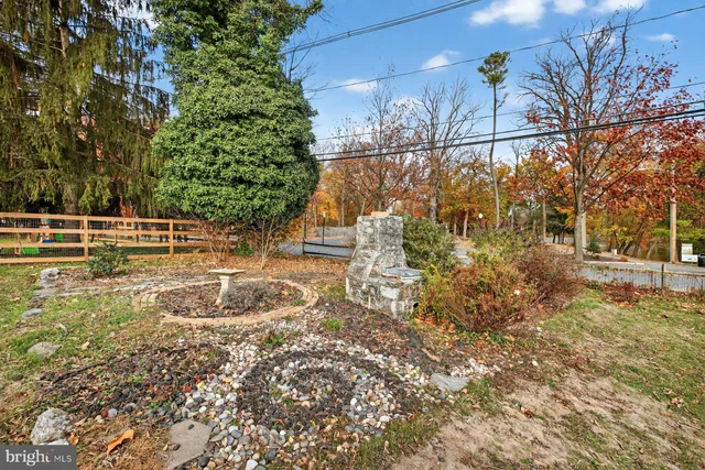 a view of a pathway both side of house