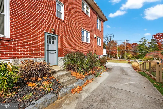 a view of a swimming pool with an outdoor space and seating area