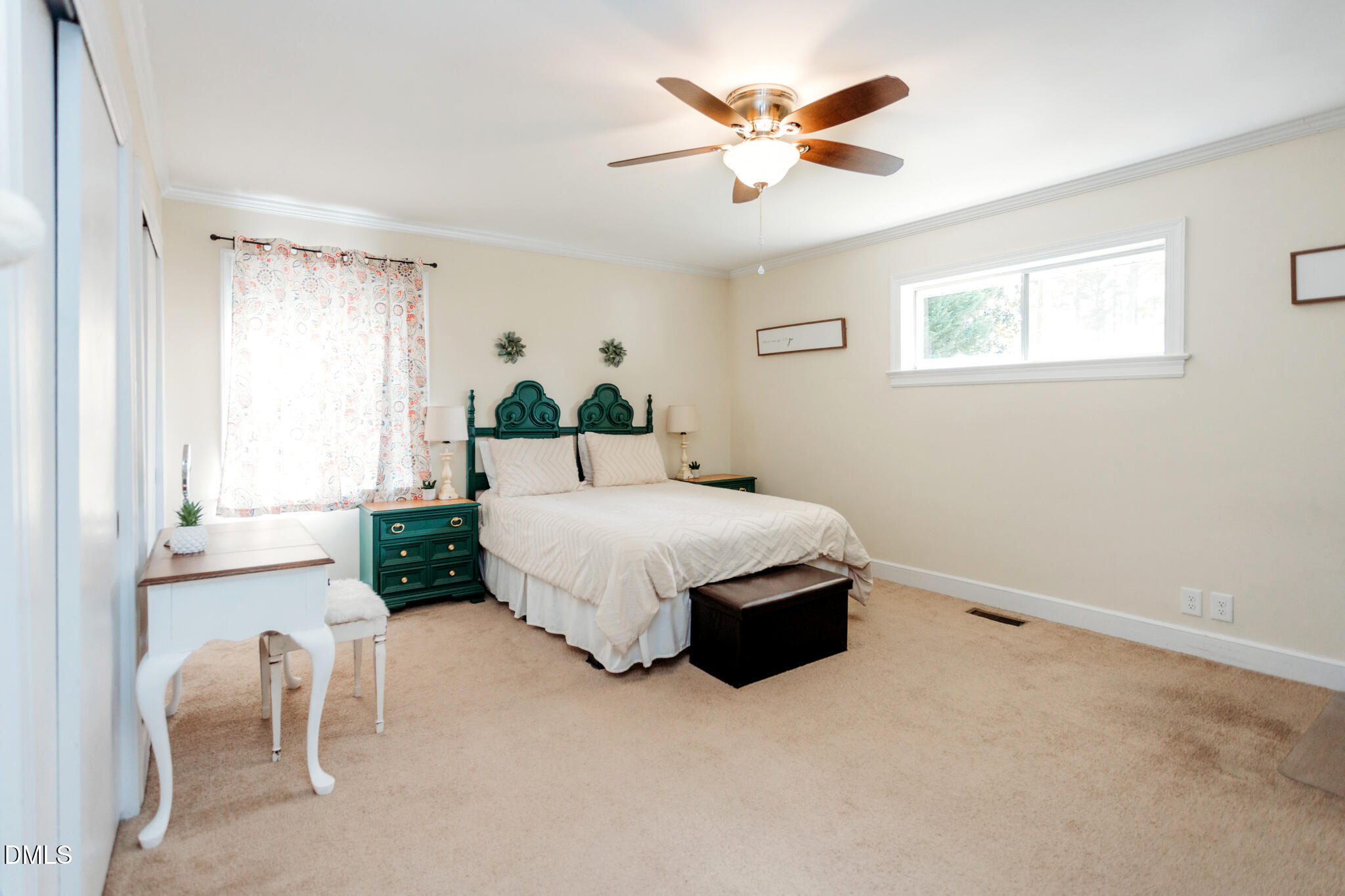 1109 Robin Hill Road Northwest Wilson, NC 27896 - Photo 12 of 19 a spacious bedroom with a bed and a chandelier