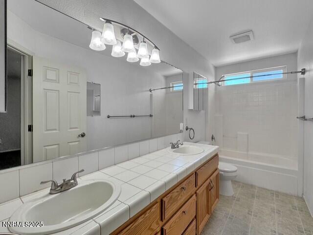 602 Tamsen Road Fernley, NV 89408 - Photo 16 of 18 a bathroom with a sink double vanity granite tub and a mirror