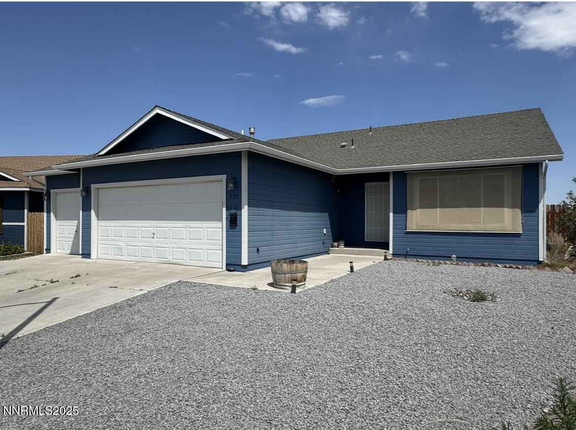 602 Tamsen Road Fernley, NV 89408 - Photo 2 of 18 a front view of a house with garage