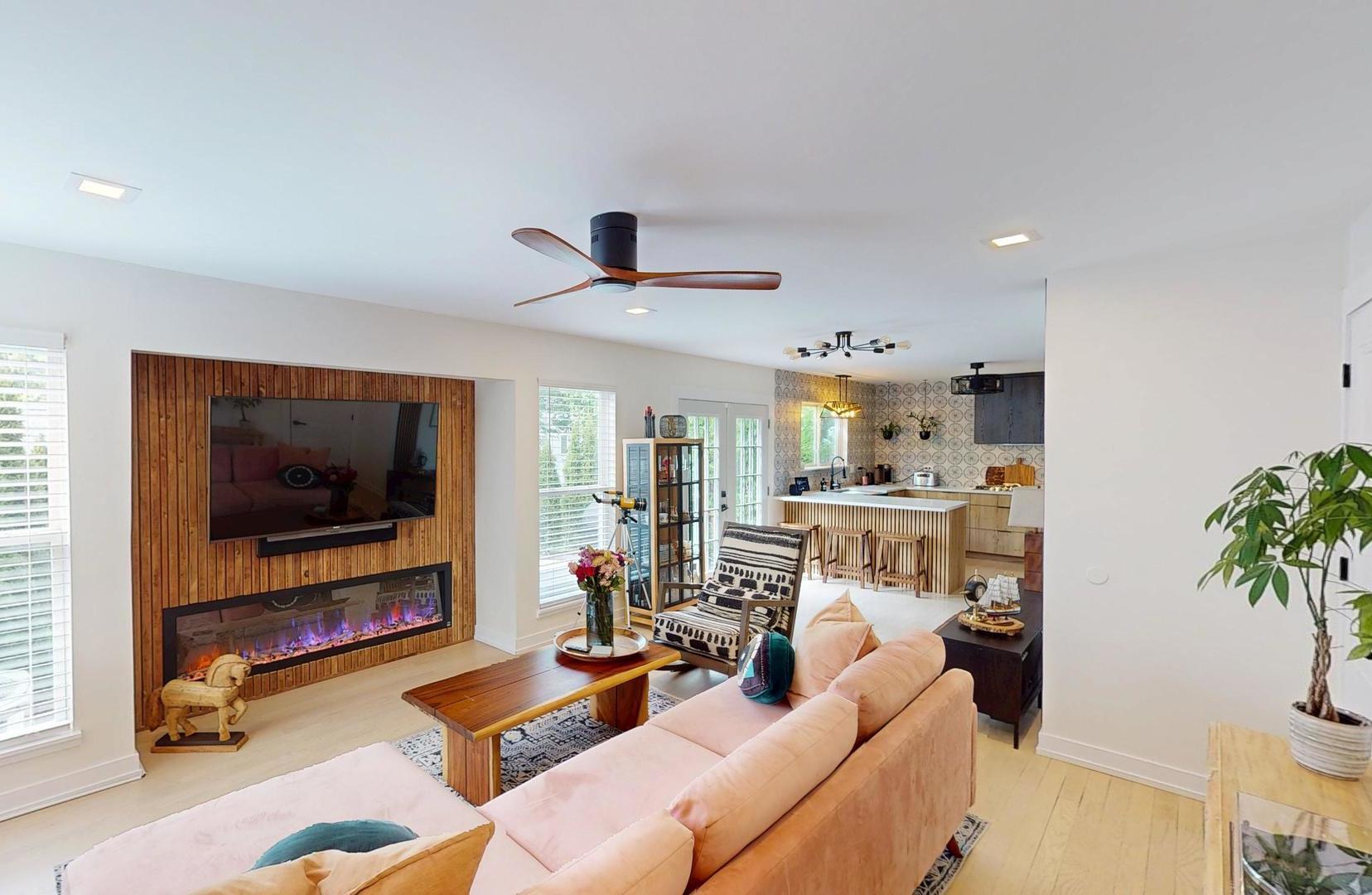 2207 Periwinkle Lane Naperville, IL 60540 - Photo 11 of 40 a living room with furniture and a flat screen tv