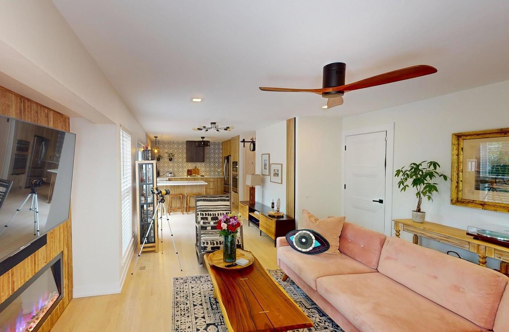 2207 Periwinkle Lane Naperville, IL 60540 - Photo 12 of 40 a living room with furniture and a flat screen tv