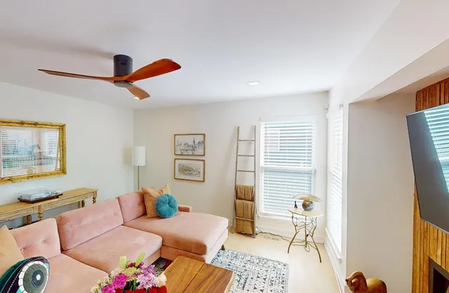 a bedroom with furniture and a window