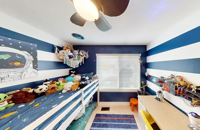 a bed room with furniture and a window