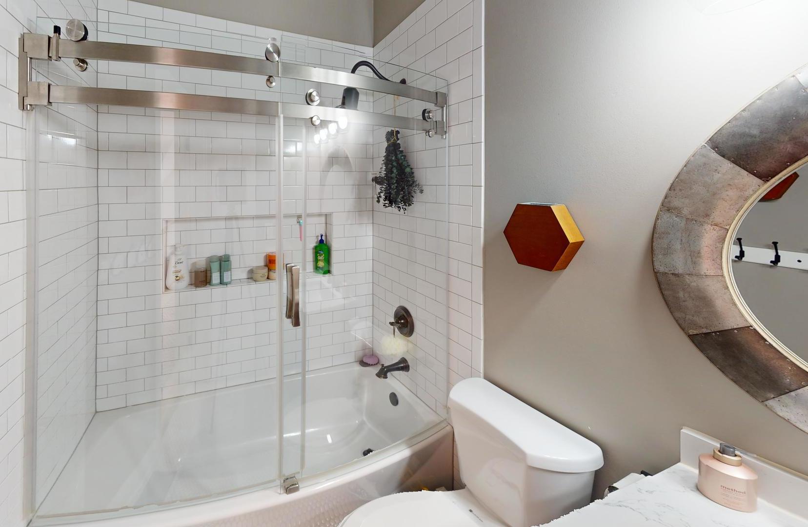 2207 Periwinkle Lane Naperville, IL 60540 - Photo 21 of 40 a bathroom with a toilet and shower