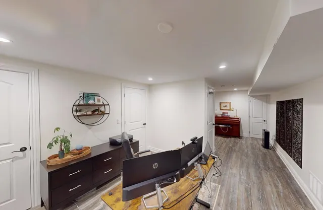 a view of workspace with wooden floor