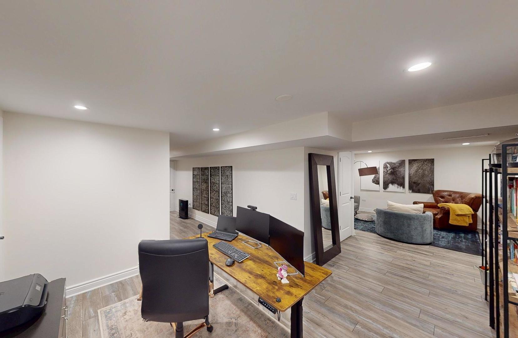 2207 Periwinkle Lane Naperville, IL 60540 - Photo 25 of 40 a living room with furniture and a wooden floor