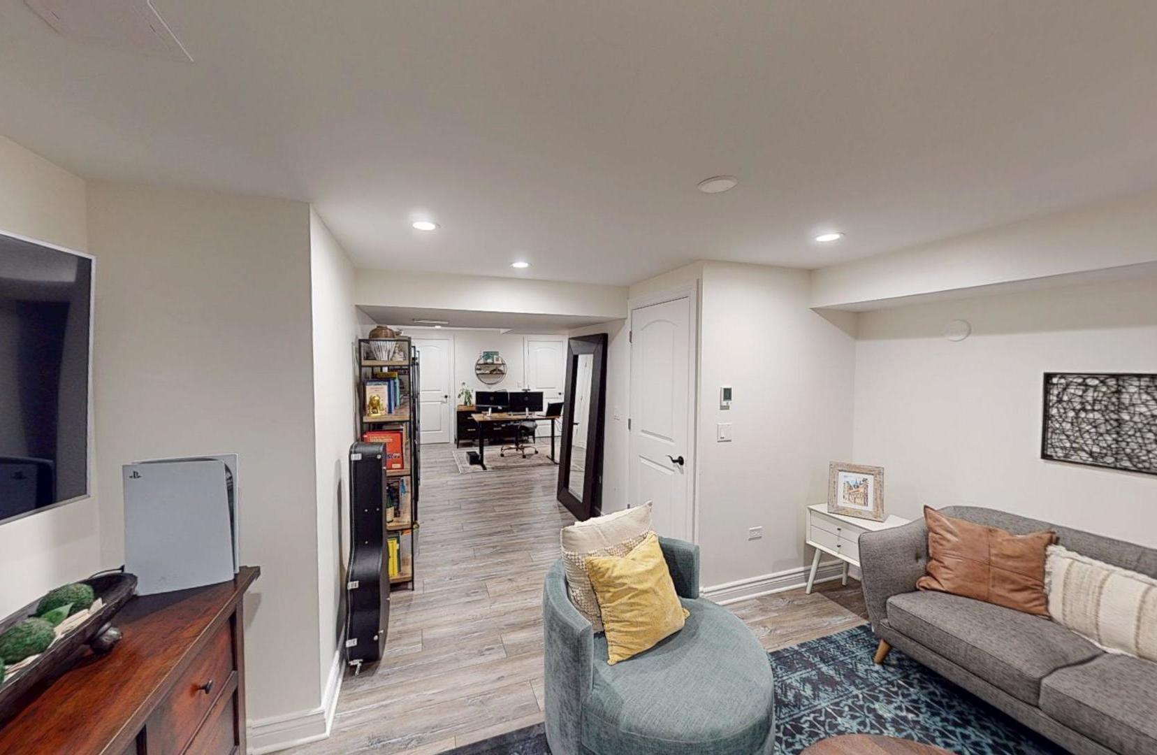 2207 Periwinkle Lane Naperville, IL 60540 - Photo 29 of 40 a living room with furniture and a flat screen tv