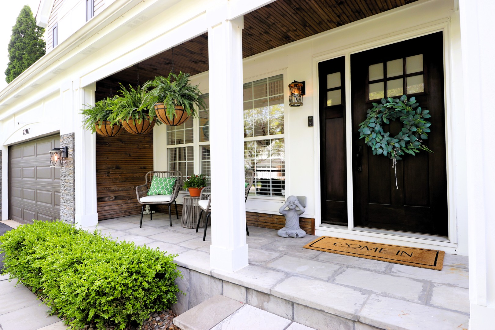2207 Periwinkle Lane Naperville, IL 60540 - Photo 35 of 40 a view of a door with a bench and a potted plant