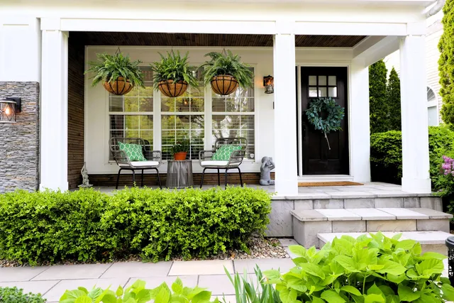 a front view of a house with a garden