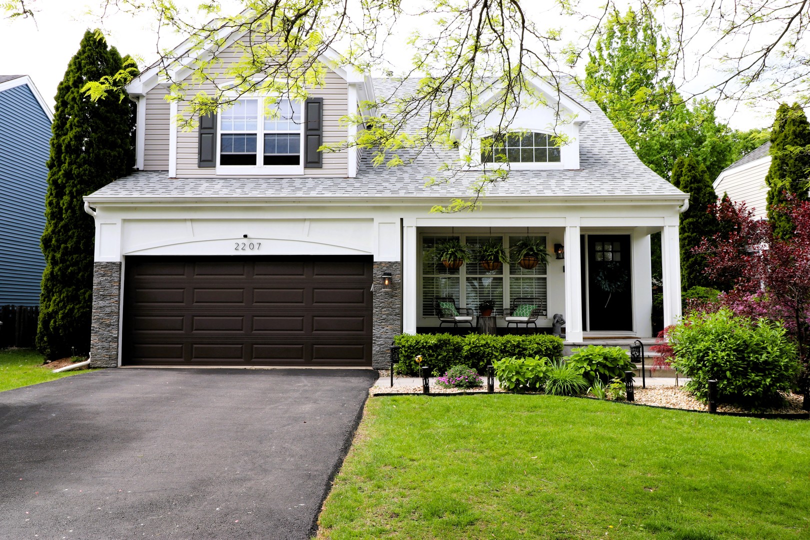 2207 Periwinkle Lane Naperville, IL 60540 - Photo 37 of 40 a front view of a house with a yard and garage