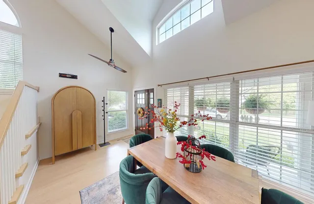 a very nice looking dining room with a large window
