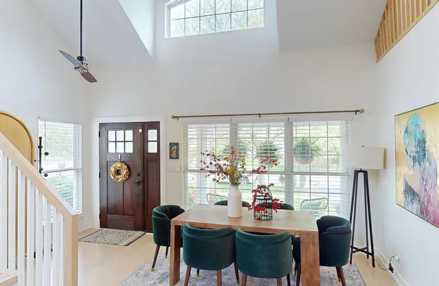 a view of a dining room with furniture window and outside view