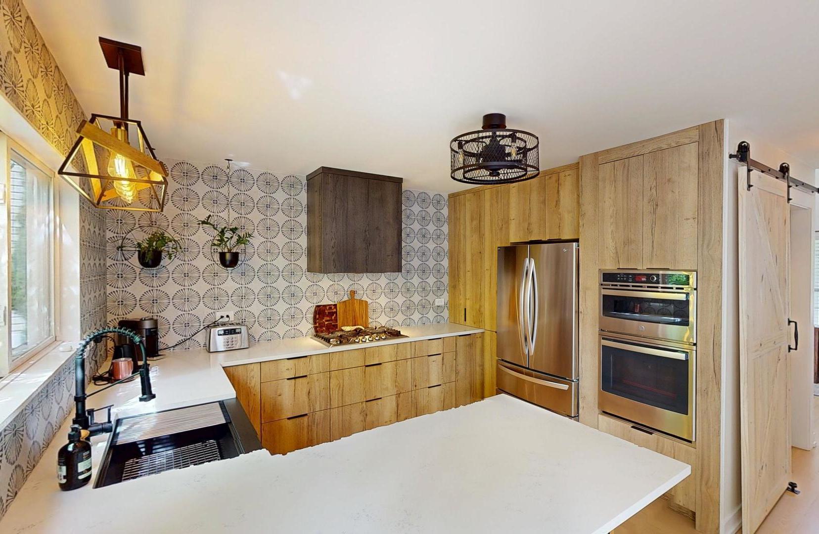 2207 Periwinkle Lane Naperville, IL 60540 - Photo 8 of 40 a kitchen with stainless steel appliances a refrigerator sink and stove