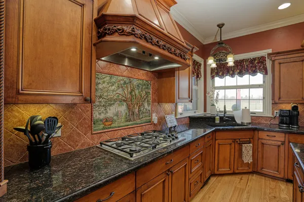 a kitchen with granite countertop lots of counter top space