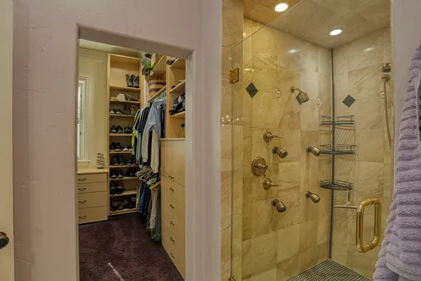 a view of a dresser with mirror in it
