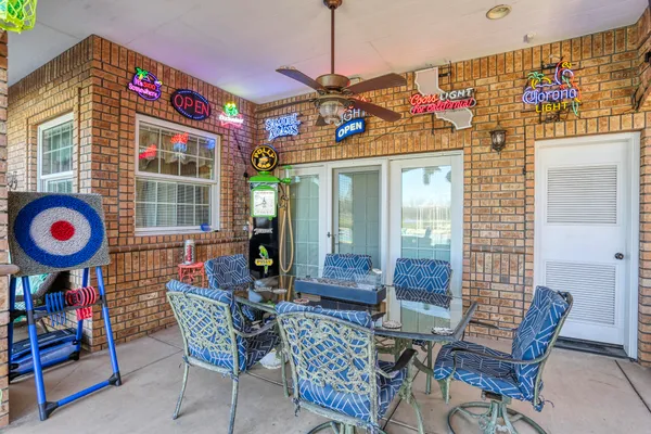 a front view of a house with a yard table and chairs