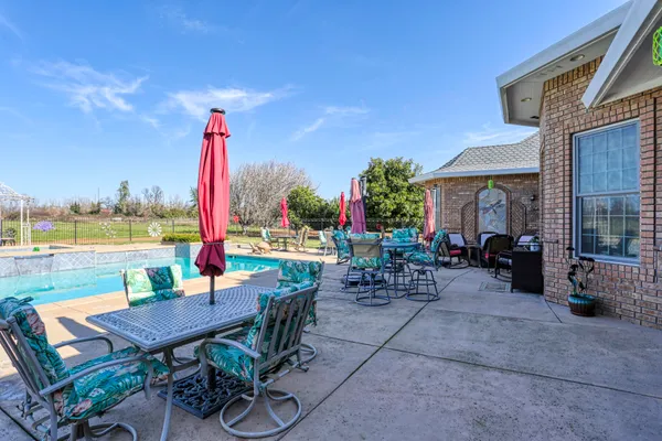 a view of house with outdoor space and sitting area